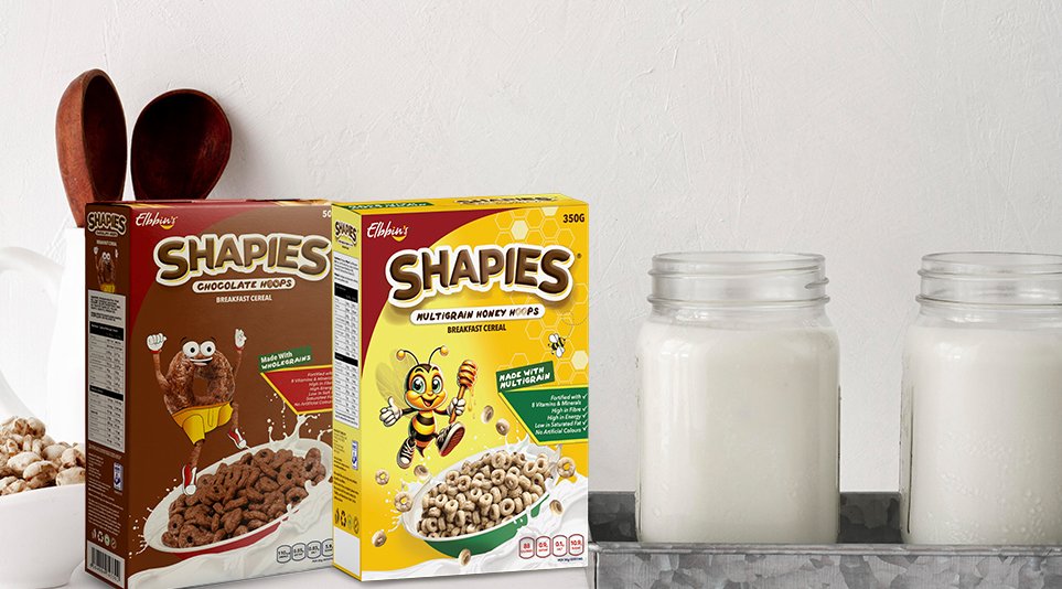 Shapies chocolate and honey cereals boxes with milk jars